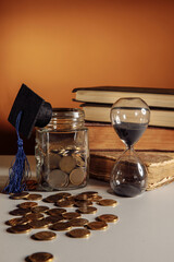 Jar with coins, graduation hat and hourglass. Savings and education theme
