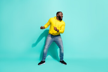 Full size photo of excited youth guy look empty space incredible discounts want run isolated over cyan color background