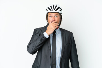 Business senior man with a bike helmet isolated on white background surprised and shocked while looking right