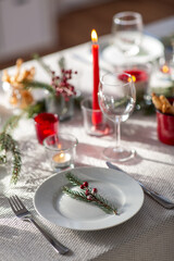 winter holidays, dinner party and celebration concept - close up of christmas table serving at home