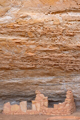 USA, Colorado. Mesa Verde National Park, remains of stonewall masonry structure against sandstone alcove wall, Step House Ruin on Wetherill Mesa.