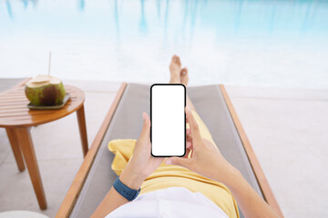 woman lie down on pool bed using phone white screen