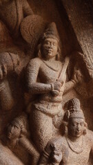 Mahishasuramartini Cave Temple. Statues carved in rock. Located in the background of the rock.A side view
