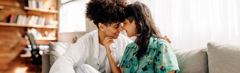 Smiling female couple sharing an intimate moment