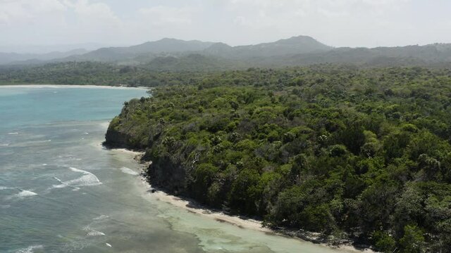 Lush Forest And White Sand Beach of Playa Teco In Maimon Dominican Republic - aerial shot