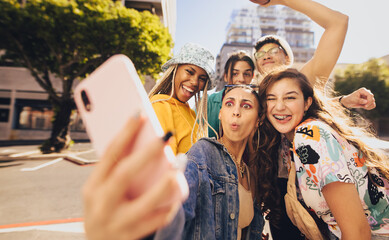 Vibrant young people taking a selfie together