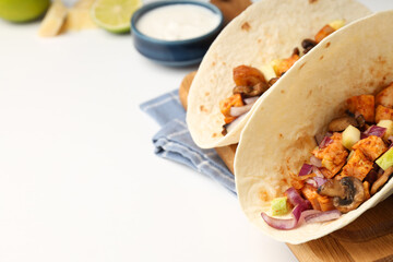 Concept of tasty food with taco on white background