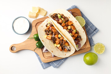 Concept of tasty food with taco on white background