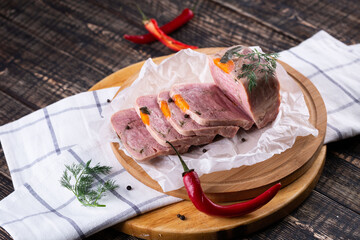 Fresh sausages and ham slices on wooden cutting board, delicious snack, spicy and high quality meat...