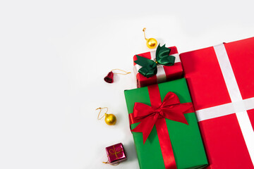 Christmas gift boxes and decoration on white background with copy space, happy holiday concepts