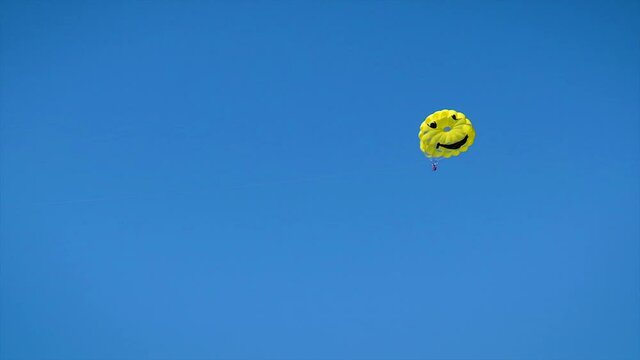Fun parasailing over the sea. Selective focus.