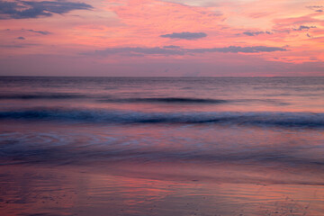 Fototapeta na wymiar USA, Georgia, Tybee Island. Colorful pink sunrise at Tybee Beach.