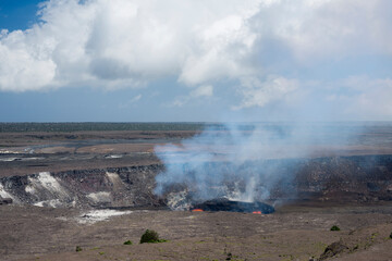 Fototapeta na wymiar USA, Hawaii, Big Island of Hawaii. Hawaii Volcanoes National Park, Lava and steam eruption in Halemaumau Crater which is located within Kilauea Crater.