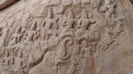 Sculptures carved in rock. The rock is located in the background
