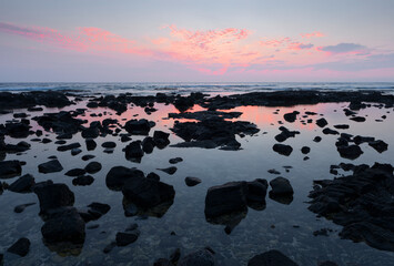 USA, Hawaii, Big Island of Hawaii. Kohanaiki Beach Park, Sunset colored sky above tidepool,...