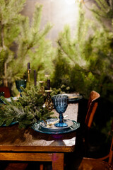 Christmas decorated dinner table in forest. Winter photo zone.