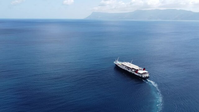 Passenger ship departing from port with destination Greek Islands.