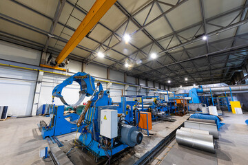 Photo shot of rolls of steel sheet stored in warehouse; Cold rolled steel coils at the factory