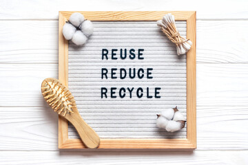 Felt board with quote text Reuse, Reduce, Recycle on white wooden table Top view Flat lay Zero...
