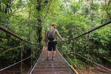 Boy on suspension bridge