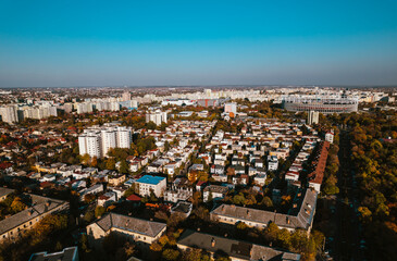 Aerial landscape of Bucharest, from the Vatra Luminoasa neighborhood with the National Arena stadium and blue sky in the background. The iconic architecture and landscape of Bucharest, Romania