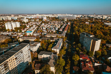 Fototapeta na wymiar Aerial landscape of Bucharest, from the Vatra Luminoasa neighborhood with the National Arena stadium and blue sky in the background. The iconic architecture and landscape of Bucharest, Romania