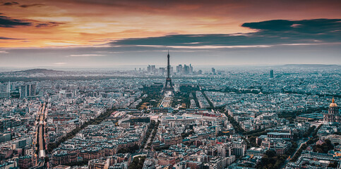 aerial view over Paris at sunset with iconic Eiffel tower