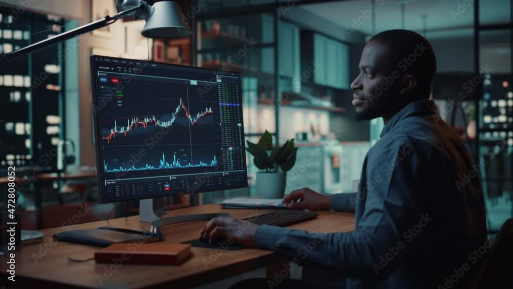 Poster Home Office Evening: Black Financial Analyst Using Computer with Display Showing Real-Time Stocks, Exchange Market Charts. Remote Working African American Trader making e-Commerce Investment