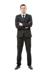 Confidence and charisma. Full length of young businessman in suit keeping arms crossed and looking at camera isolated on white background.