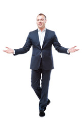 You are welcome! Cheerful businessman in suit gesturing welcome sign and smiling while walking. Isolated on white.