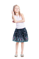 Fototapeta premium I got idea! Full length of thoughtful little girl pointing up. Isolated on white.