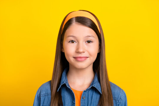 Photo of adorable cute preteen girl dressed jeans shirt vintage headband smiling isolated yellow color background