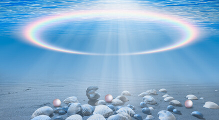 Underwater rainbow concept - Blue sea or ocean water surface and underwater with sunny day - Many...