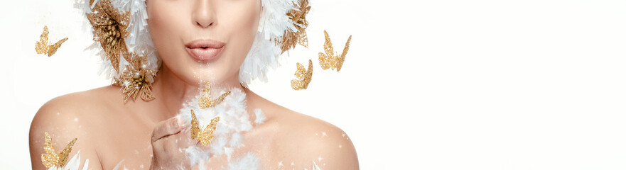 Christmas Fantasy Fashion panorama banner with gold butterflies. Beautiful winter Christmas woman...