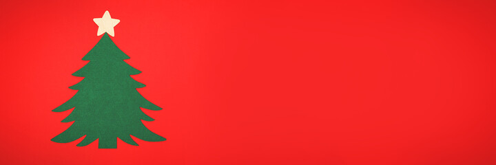 Green Christmas tree on a red background