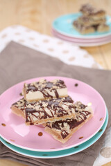 Cake with biscuits, chocolate and cream