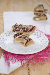 Cake with biscuits, chocolate and cream