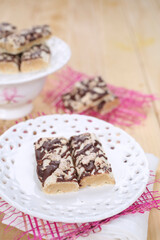 Cake with biscuits, chocolate and cream