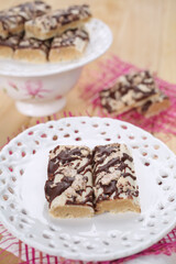 Cake with biscuits, chocolate and cream