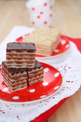Homemade waffle dessert with chocolate, biscuits and nuts