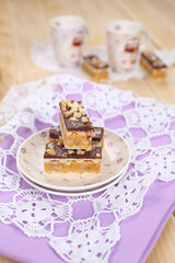 Homemade waffle dessert with chocolate, biscuits and nuts