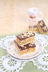 Homemade waffle dessert with chocolate, biscuits and nuts