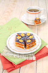 Homemade waffle dessert with chocolate, biscuits and nuts