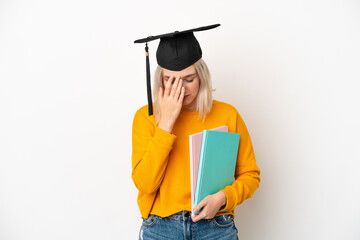 Young university caucasian woman graduate isolated on white background with tired and sick expression