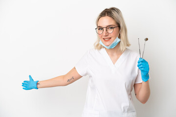 Dentist caucasian woman holding tools isolated on white background extending hands to the side for inviting to come