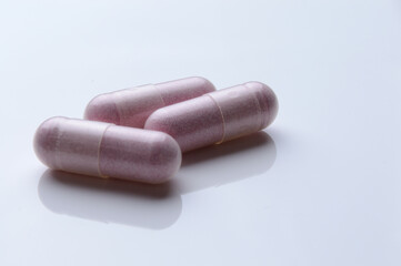 close up of medical capsules on white background