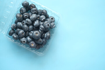 Close up of fresh blue berry with water drops .