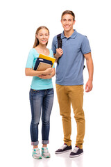 Youth and education. Young attractive students couple standing together. Full length studio...