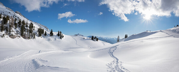stunning winter landscape Rofan alps, with ski piste and foot tracks - obrazy, fototapety, plakaty
