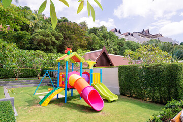 Colorful children playground in tropical resort.